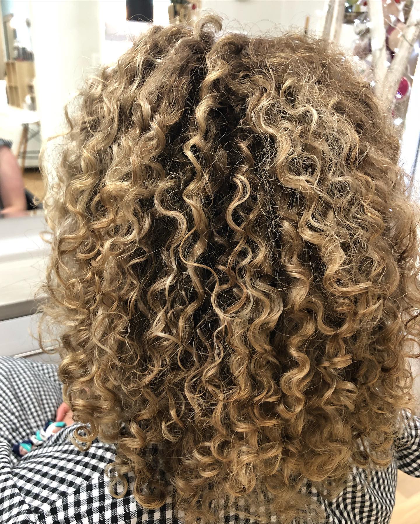 Woman with beautiful natural curls enjoying outdoor Toowoomba setting