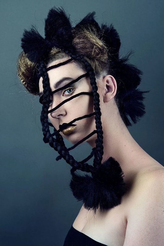 A woman with rope-like mask in her face, posing, close-up