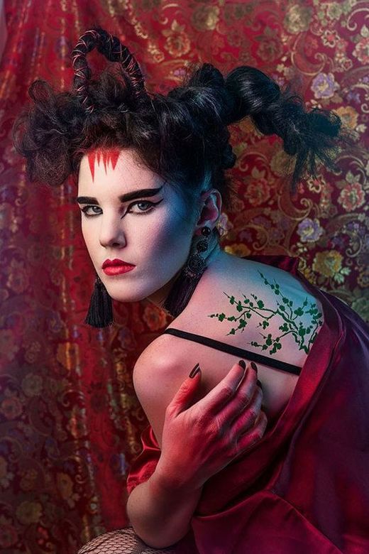 A woman with Ancient Japanese inspired make-up, posing