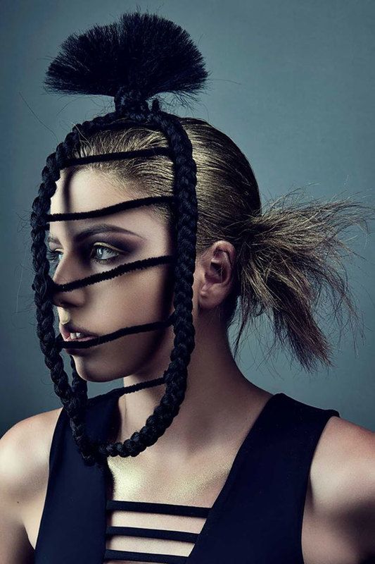 A woman with a rope-like decoration on her face