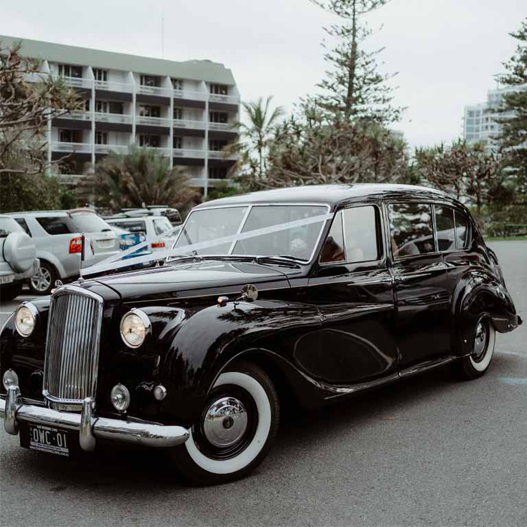 A wideshot of a wedding car