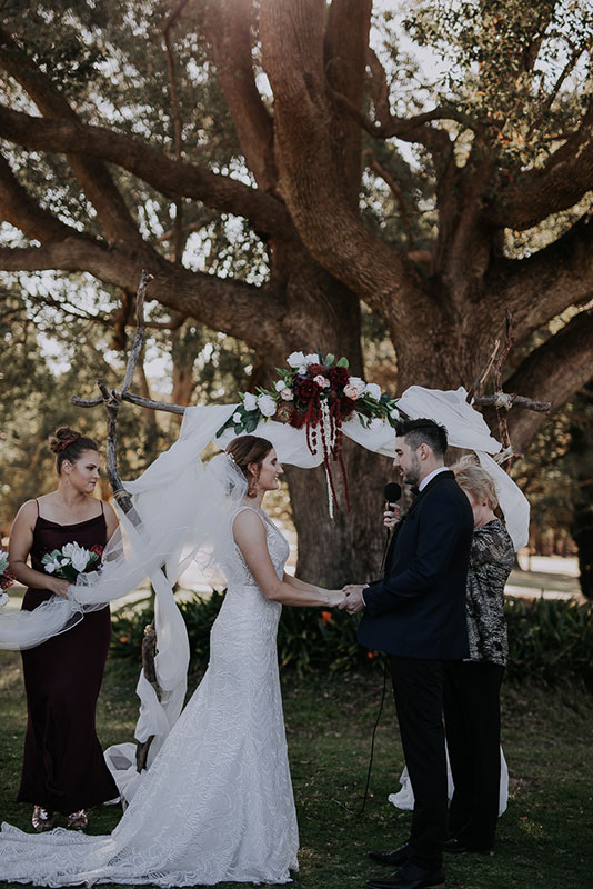A groom and bride in a wedding ceremony