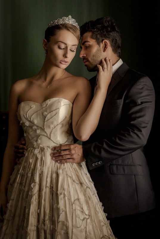 A woman and a man, intimately posing