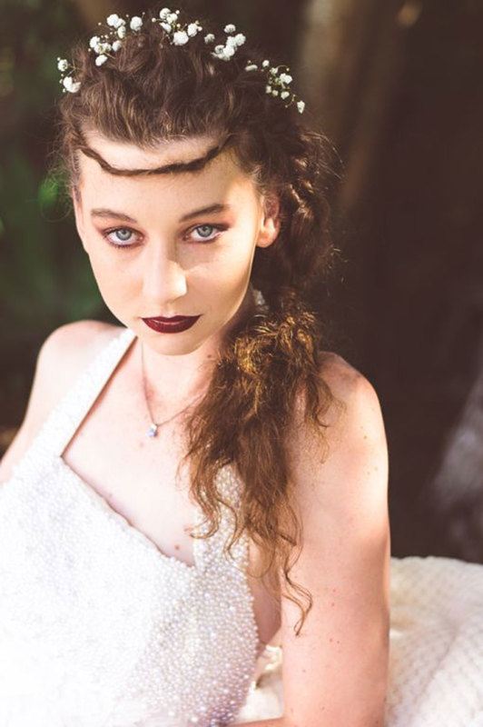 A close up of a woman in white dress