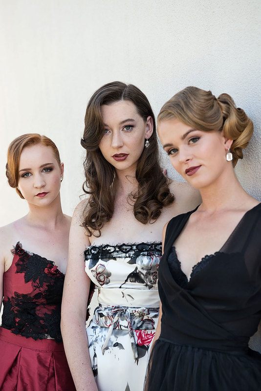 3 women in dress posing