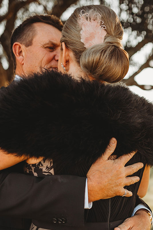 A man hugging a woman
