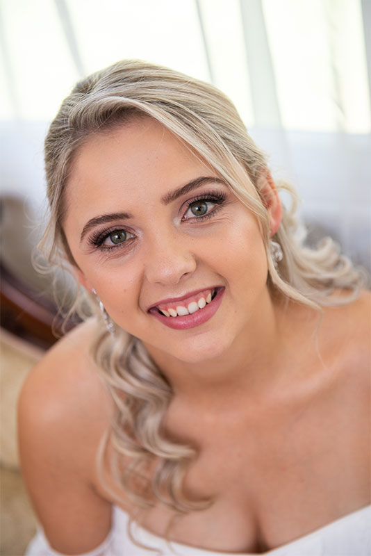A woman, close-up, smiling wide