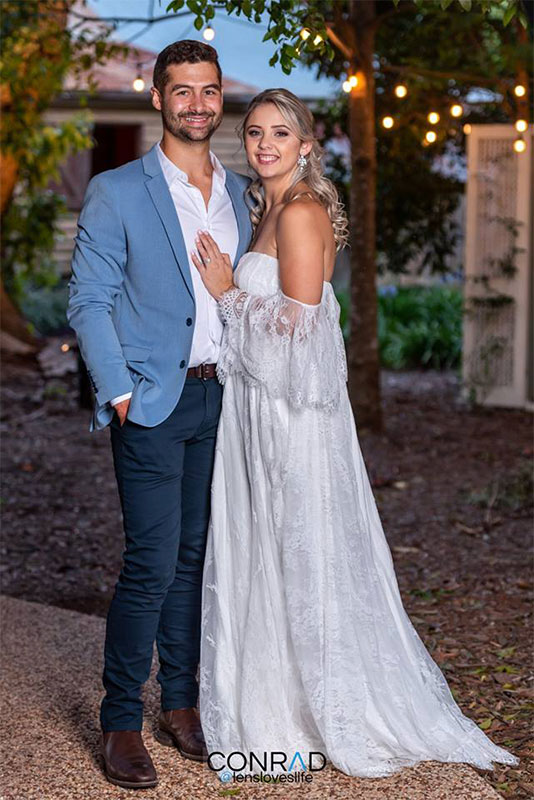 A man and a woman, full body shot, standing next to each other